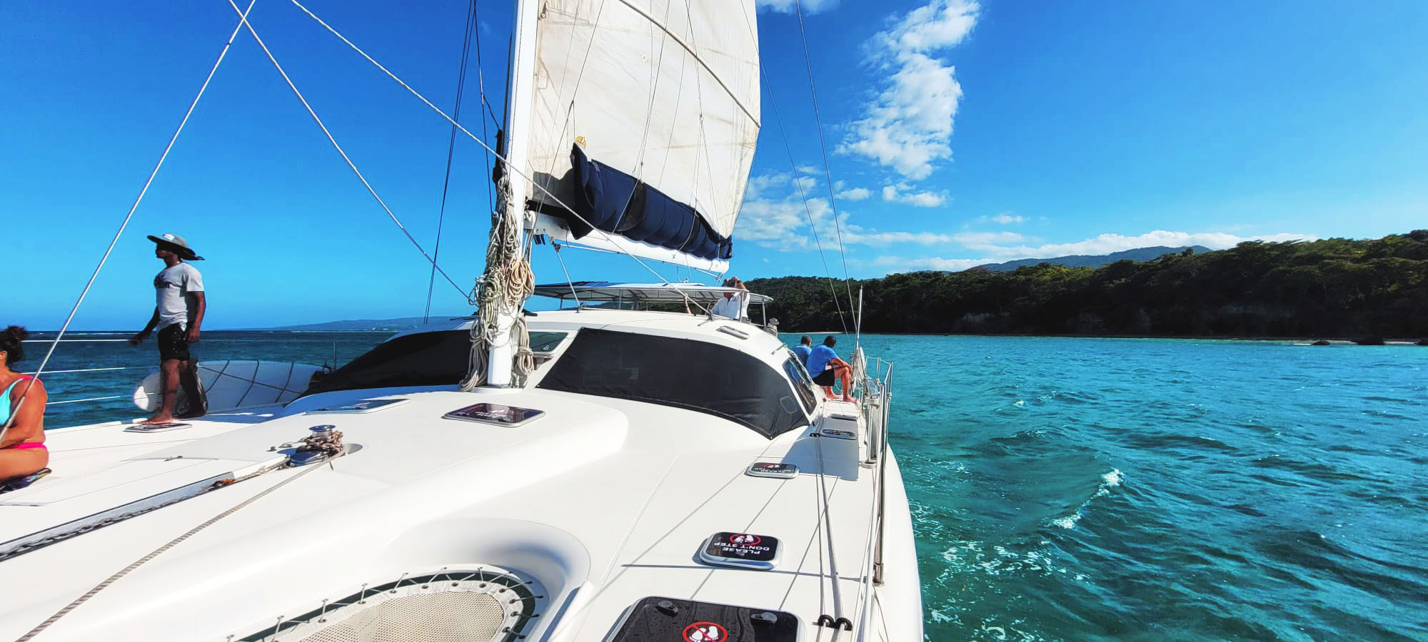 Experience turquoise waters as you sail along Jamaica's north coast on a 45' Privilege sailing catamaran